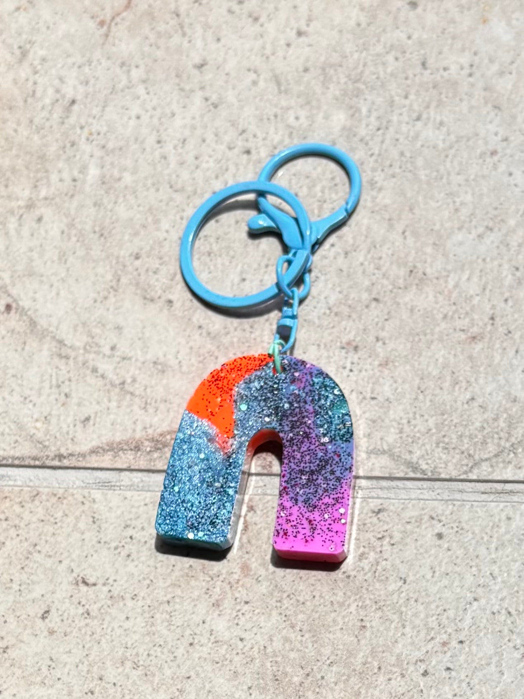 blue, orange and purple keychain